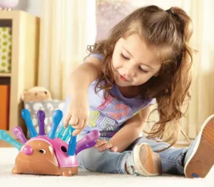 Baby toy for fine motor skills - Spike the Hedgehog - pink