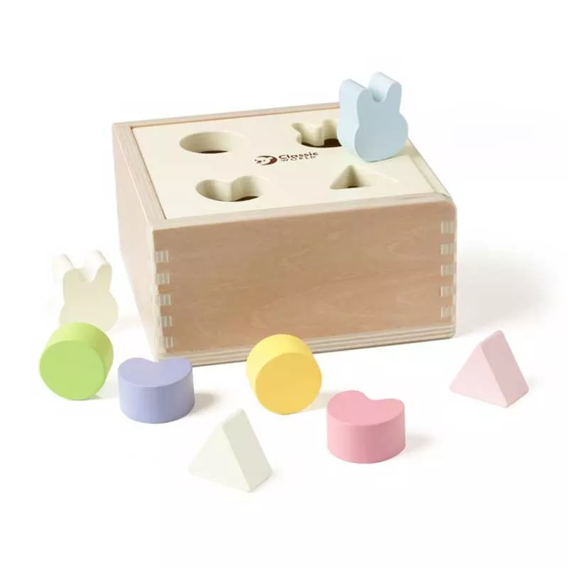 Wooden box for sorting shapes in pastel colors