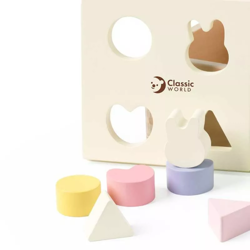 Wooden box for sorting shapes in pastel colors