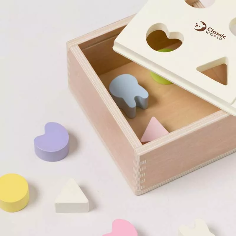 Wooden box for sorting shapes in pastel colors