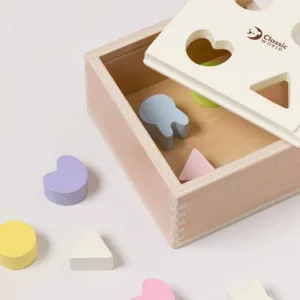 Wooden box for sorting shapes in pastel colors