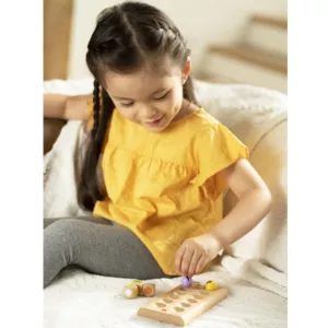 A children's wooden game for fine motor skills - Sweet little bees