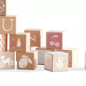 Children's construction set made of wooden blocks with various symbols