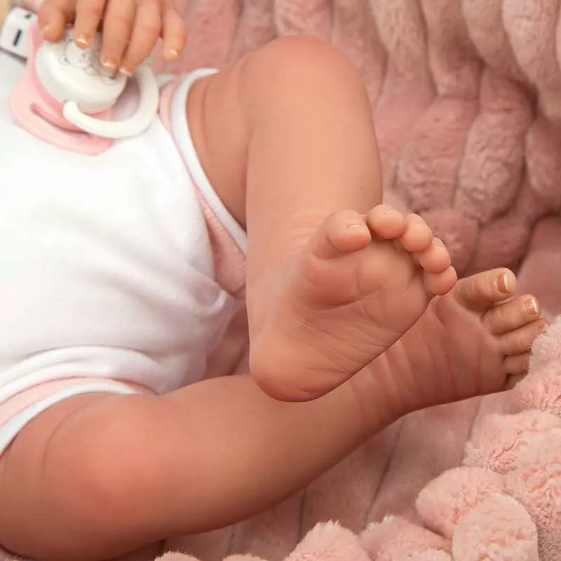 Doll-baby Lola in a pink plush basket, actual weight - 40 cm