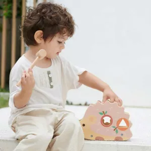 Funny wooden hedgehog - sorter with xylophone in pastel colors