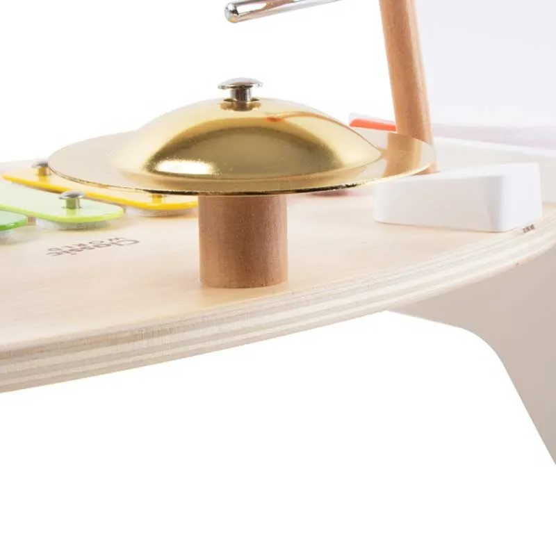 Children's wooden table with musical instruments