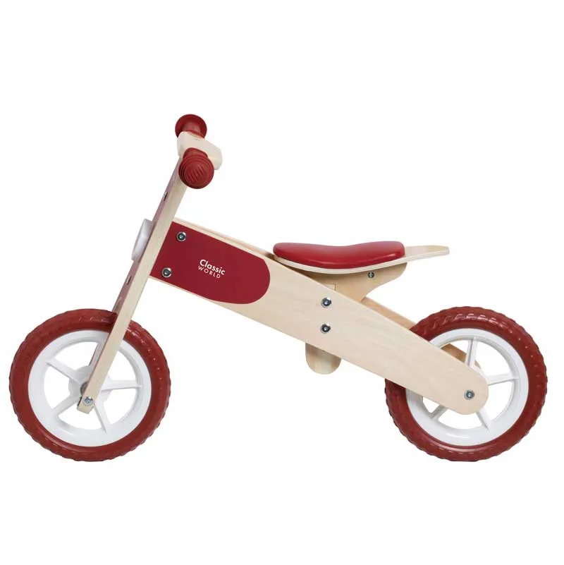 Wooden balance bike Classic World in burgundy color, for ages 2 and up.